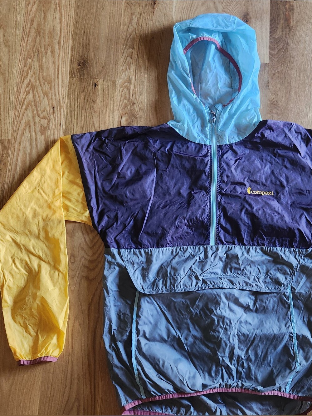 Cotopaxi Colorblock Womans Hooded Rain Pullover- Light Blue, Purple & Yellow